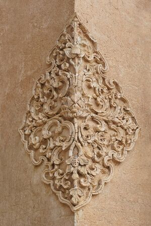 Thailand temple wall art flower made ??of cement brickの写真素材
