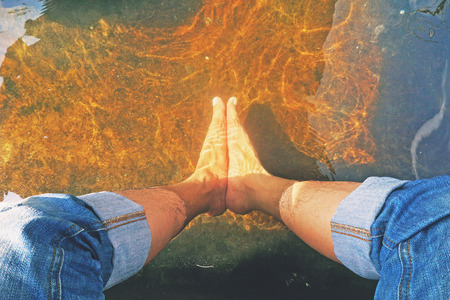 Male Feet Soak in hot springs for health feetの写真素材