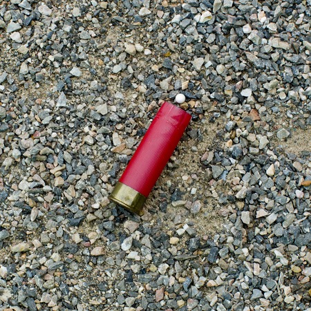 Red shotgun shell that has been firedの写真素材