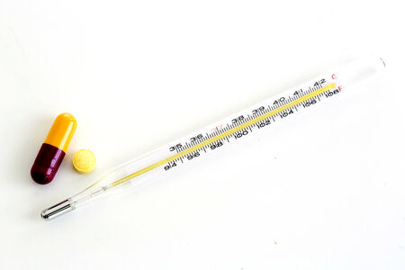 a thermometer with medicineの写真素材