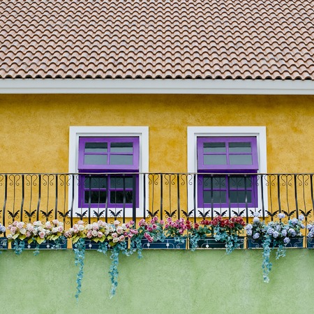Colorful house with violet and white windowsの写真素材