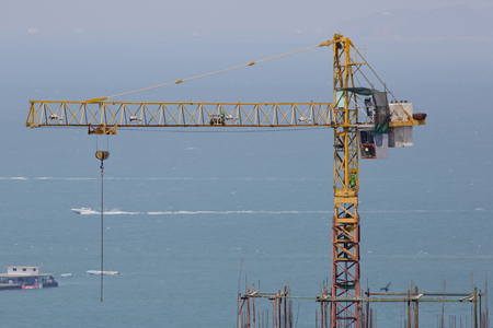 hoisting crane with the blue skyの写真素材