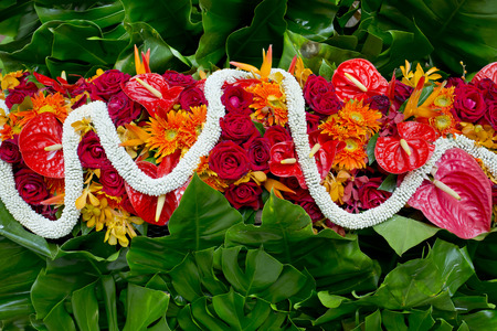 Gardenia, red roses and gree leaf, Thai style fresh flower decorationの写真素材