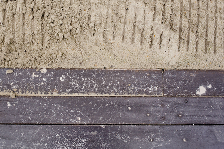 wooden boards against sandy backgroundの写真素材