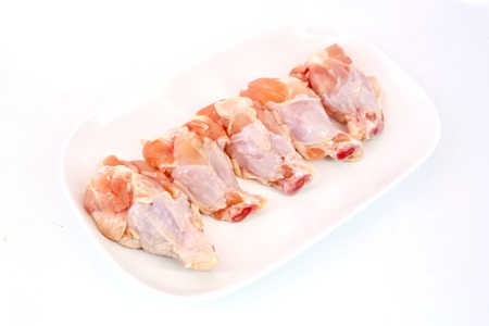 Fresh raw chicken wings isolate on white ready to be grilledの写真素材