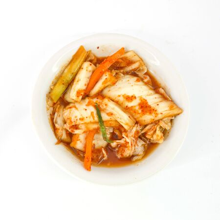 close-up kimuchi on white dish isolate on white backgroundの写真素材