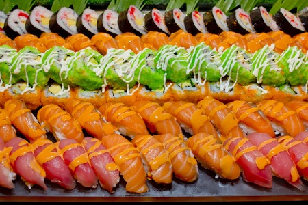 Japanese Cuisine -Buffet catering style Sushi Set in restaurant - salmon Maki Sushi and Nigiri Sushiの写真素材