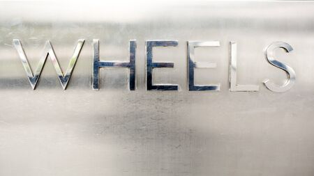 the word wheels with metal materiall  3d illustrationの写真素材