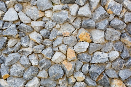 pattern gray color of modern style design decorative uneven cracked real stone wall surface with cementの写真素材