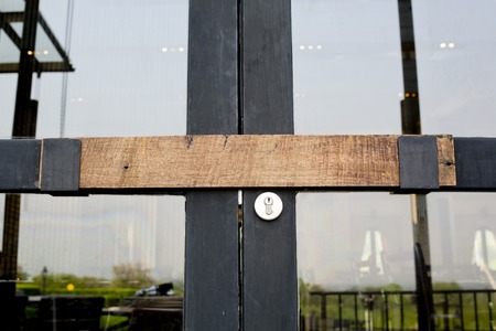 The latch of the ancient Asian style made by wood integrate with modernized doorの写真素材