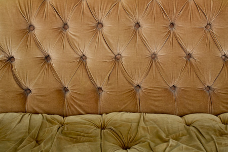 Brown couch background texture with sunken buttonsの写真素材