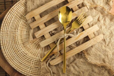 Wood heating pad with spoon and fork with blank space for textの写真素材