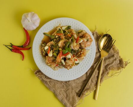 Stir-fried shrimp with chilli with garlic and chilli and spoon aの写真素材