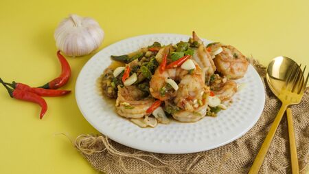 Stir-fried shrimp with chilli with garlic and chilli and spoon aの写真素材