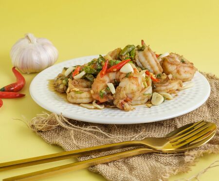 Stir-fried shrimp with chilli with garlic and chilli and spoon aの写真素材