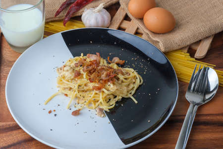 Spaghetti Carbonara,Carbonara pasta, hard parmesan cheese and crの写真素材