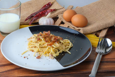Spaghetti Carbonara,Carbonara pasta, hard parmesan cheese and crの写真素材