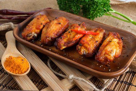 Spicy buffalo chicken wings covered by spices.の写真素材