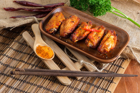 Spicy buffalo chicken wings covered by spices.の写真素材