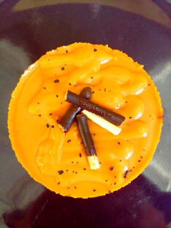 Sweet cake flavored milk tea on dish and have snacks on top.の素材