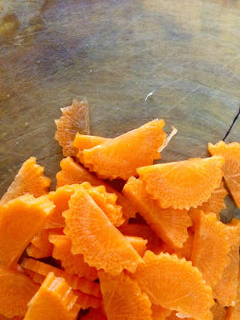 Slice carrot on wood boardの素材