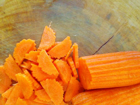 Slice carrot on wood boardの素材