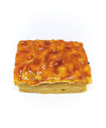 caramel cashew toffee cake isolation on white background. bakery homemade golden cakeの写真素材