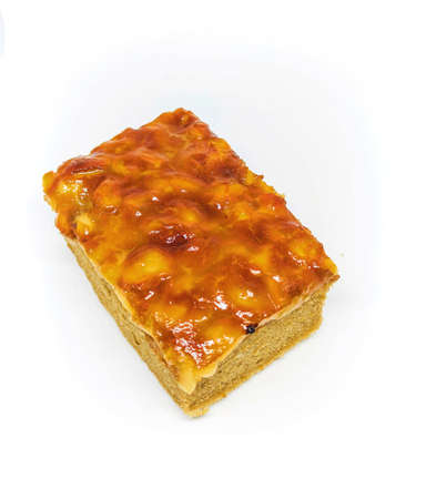 caramel cashew toffee cake isolation on white background. bakery homemade golden cakeの写真素材