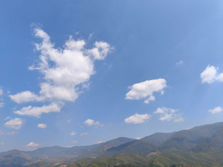 Thailand's mountains with lots of green trees, clear sky and white clouds. This location is Nan in Thailand.の写真素材