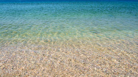 Clear transparent sea water, ukrainian beach in Odesa, natural marine backgroundの写真素材