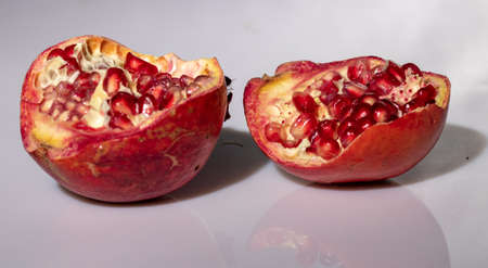 ripe pomegranate with reflection on the glassの写真素材
