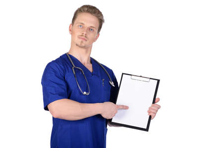 Man doctor in blue suit with clipboard in hand  Isolated on white backgroundの写真素材