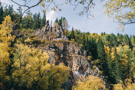 Autumn landscape. Forest, river, stones, rock, leaves.の写真素材