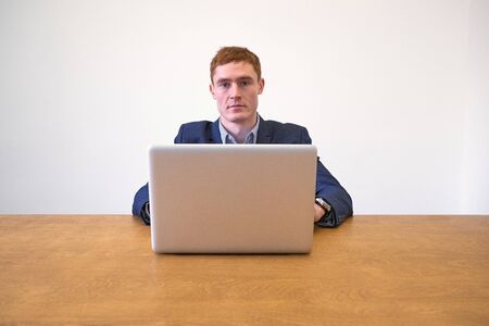 Mature european Man Using Laptop On Deskの写真素材