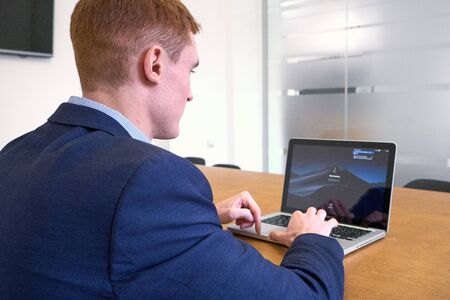 Mature european Man Using Laptop On Deskの写真素材