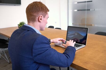 Mature european Man Using Laptop On Deskの写真素材