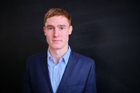 Mature European man with red hair on a black backgroundの写真素材