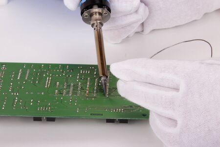 Soldering a boardの写真素材