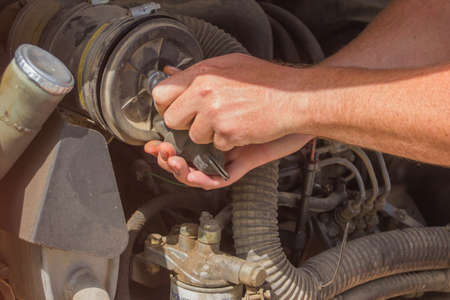 Maintenance of a mini excavatorの写真素材