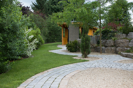 Garden with natural stone wallの写真素材
