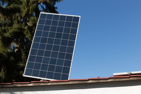 Mounting a solar panelの写真素材