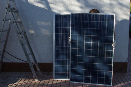 Mounting a solar panelの写真素材