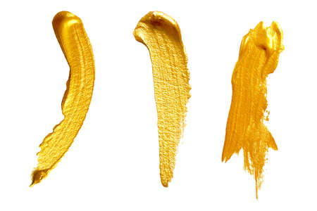 Watercolor gold paint smear stroke stain. Abstract gold glittering textured background.の写真素材