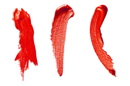 Red lipstick paint smear stroke stain. Abstract red glittering textured background.の写真素材