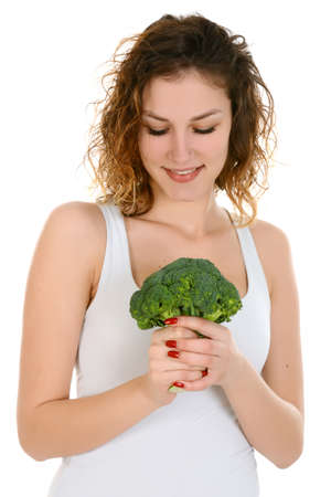 Young attractive woman holding broccoliの写真素材