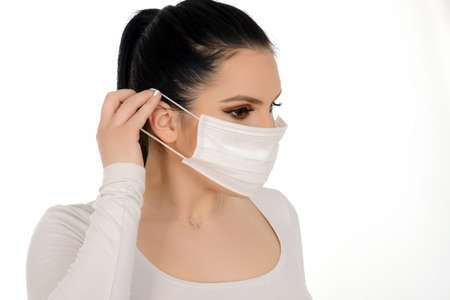 Close up portrait of female doctor or nurse wearing protective mask