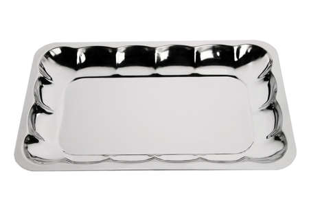 Stainless tray on white background. Empty serving tray. Silver tray with floral ornamentの写真素材