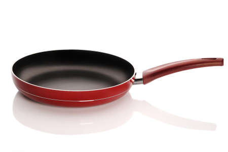 Red empty frying pan isolated on white backgroundの写真素材