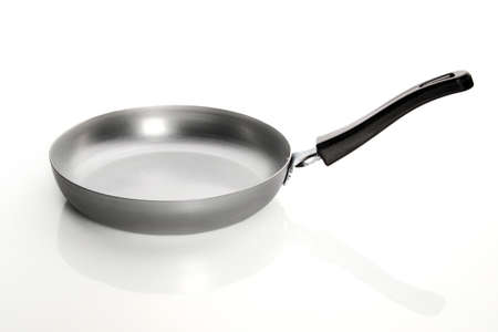 Silver empty frying pan isolated on white backgroundの写真素材