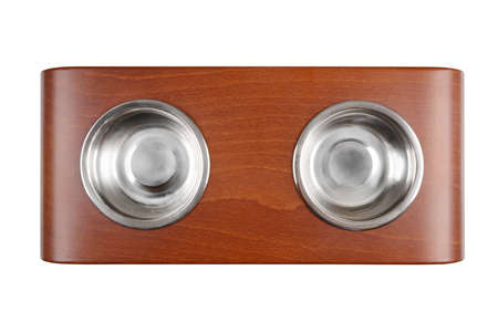 Two pets bowls on wooden stand isolated on white backgroundの写真素材